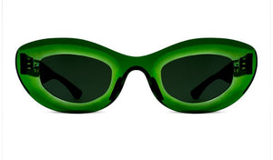 Thierry Lasry's Jazz sunglasses, featuring green oval frames with dark lenses, showcased against a white background.