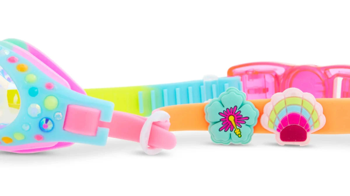 The Bling2O Tropical Rhinestone Swim Goggles feature colorful, beach-inspired designs with sparkling rhinestones and decorative flower and shell accents, shown close up on a white background.