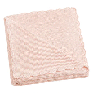 The Gooselings Cotton Knit Baby Blanket is a delicately folded, light pink knit adorned with a handstitched scalloped design and made from 100% cotton.