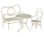 This charming Maileg Mouse Cafe Set in off-white includes a round table, two-seater bench, and chair with elegant curves and perforated designs, perfect for entertaining little guests like your sibling.