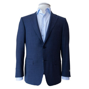 A Canali Deep Blue Plaid Blazer on a tailor's mannequin, paired with a light blue dress shirt.