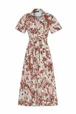 The Cara Cara Mardi Dress is a short-sleeved, collared midi dress with a button-down front and a brown and white botanical print.