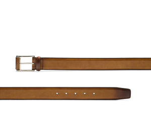The luxurious Velaz Belt by Magnanni is crafted from supple calfskin leather, featuring a silver buckle and multiple holes for easy adjustment.