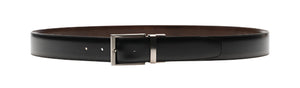 The Lados Reversible Belt by Magnanni, crafted from black calfskin leather with a silver buckle, elegantly forms a circle.