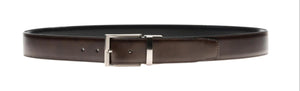 The Lados Reversible Belt by Magnanni is crafted from rich brown calfskin leather and features a polished silver buckle, elegantly presented against a white background.