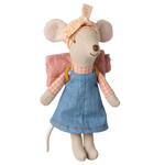 The Maileg Hiker Mouse, Big Sister is dressed for adventure in a pink checkered shirt, blue dress, and floral headband, complete with wings on its back to add a touch of wild nature to playtime.