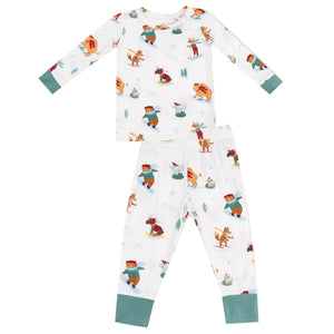 Angel Dear's Baby Boys' and Boys' Long Sleeve Loungewear Set features a winter animal print with bears, deer, and foxes skiing and skating on white breathable fabric with green cuffs.