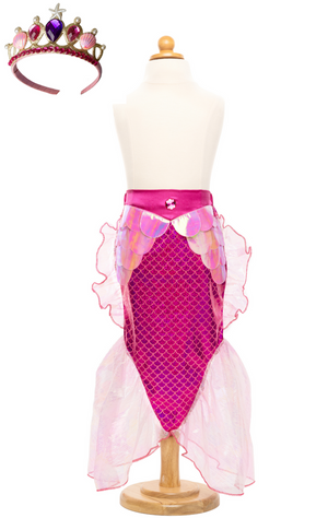 The Great Pretenders' Mermaid Glimmer Skirt and Tiara on a mannequin showcases a child-sized, shimmering iridescent foil print with fish scale design and sheer side fins, paired with a matching tiara.