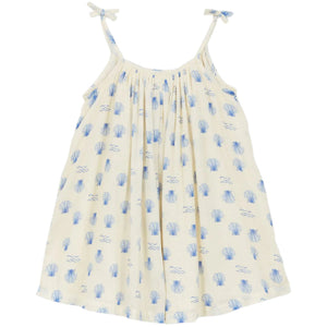 The Girls' Felicidade Dress by Arsene & Les Pipelettes features a sleeveless design with enchanting seashell and wave patterns and tie shoulder straps—perfect for a refreshing spring-summer look.