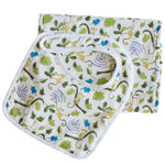 The Timo & Violet Baby Essentials Bib & Burp Set is crafted from soft cotton muslin and showcases playful monkeys with green leaves on a crisp white background.