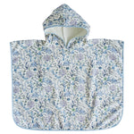 The Timo & Violet Swim Poncho for kids features a floral and seaweed pattern in soft blue and lavender, shown flat on a white background.