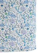 The Timo & Violet Crib Sheet features a soft, breathable design with blue and purple sea life—including octopuses, fish, coral, and seaweed—on a white background, perfect for your little one's nursery.