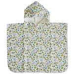 The Timo & Violet Swim Poncho is a kids' hooded towel with a white background and green, blue, and beige leaf and branch patterns—ideal as an organic cotton swim poncho.