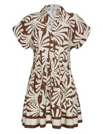 The Nash Mini Dress by Cara Cara is a short-sleeved, button-front shirtdress featuring a brown and white abstract leaf print and a fit-and-flare silhouette.