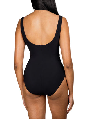 A woman with long dark hair is shown from the back in the Karla Colletto Smart Surplice One Piece swimsuit, highlighting its timeless silhouette against a white background.