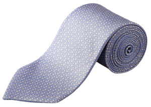 The Eton Geometric Print Silk Tie, in light blue with a subtle geometric pattern, is neatly rolled and displayed on a white background.