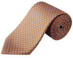 The Eton Geometric Print Silk Tie is crafted from refined twill and features a rolled-up orange design with blue and white geometric accents.