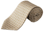 The Eton Geometric Print Silk Tie, in beige and brown, is rolled up to showcase its elegant twill weave and striking geometric design.