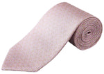 The Eton Geometric Print Silk Tie features a subtle geometric pattern in light pink silk, shown rolled up on a white background—perfect for classic suiting.