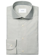 The Eton Slim Wide Spread Micro Check Twill Shirt is a light gray, wrinkle-resistant organic cotton shirt with a classic collar, buttoned cuffs, and subtle micro-pattern, featuring the "Eton" label on the inside collar.
