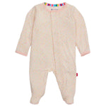 The Baby Girls' Bedford Floral Modal Footie by Magnetic Me is an infant onesie with long sleeves, made from eco-friendly TENCEL™ modal in light pink, featuring a small floral pattern and a rainbow-striped collar.