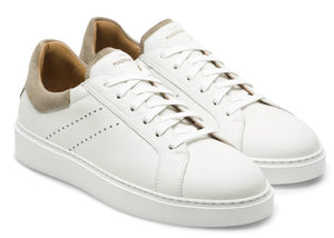 Discover the Reina III Sneakers by Magnanni: white leather sneakers featuring tan suede heel accents and elegant white laces, all set against a crisp white backdrop.