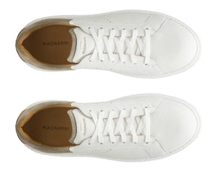 Top view of Magnanni's "Reina III Sneakers," white leather with laces, stylish leather accent, and brown insoles.