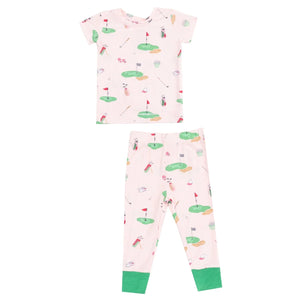 The Angel Dear Baby and Kids' Golf Things Short Loungewear Set is a super-soft, 2-piece pajama set with short sleeves, long pants, green cuffs, and a golf-themed print on light pink. Snug-fitting for comfort and safety.