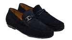 The Monterey Braid Bit Driver Loafer by Magnanni is a slip-on crafted from dark blue suede, featuring a metal buckle and braided detail on a supple calfskin upper, finished with a rubber sole for added comfort.