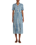 An individual in the Emporio Sirenuse Claudia Ikat Stripe Dress with blue and white stripes, short sleeves, and a matching belt stands gracefully in sandals.