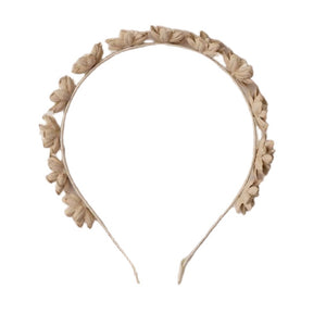 The Floral Headband by Noralee features delicate beige fabric flower petals arranged evenly along the top, making it a charming statement accessory for any occasion.