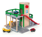 The Brio Parking Garage set includes a race car ramp with a red slide, a green and beige elevator tower, and small toy cars in blue, black, red, and yellow on various levels for endless excitement.