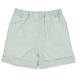 The Kidiwi Adam Short for baby boys and boys features a light green color, elastic waistband, belt loops, and a folded hem—ideal for a stylish summer wardrobe.