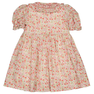 The Kidiwi Baby Girls' and Girls' Adeline Smocked Dress is a pink and white floral-patterned dress featuring short puff sleeves, a smocked waist, and a gathered silhouette.
