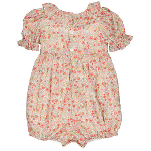 The Baby Girls' Anthea Smocked Romper by Kidiwi is a charming floral-patterned outfit with an embroidered collar, ruffle details, and front buttons, made from OEKO TEX certified cotton to ensure your baby's comfort.