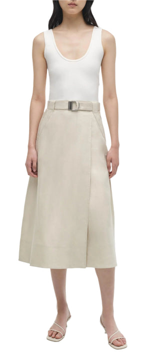 A woman wearing the Simkhai Camden Tank Midi Dress, standing against a white background.