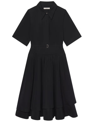The CO Short Sleeve Belted Dress is a black cotton poplin shirt dress with a collared neckline, button front, belted waist, and tiered chic midi skirt.