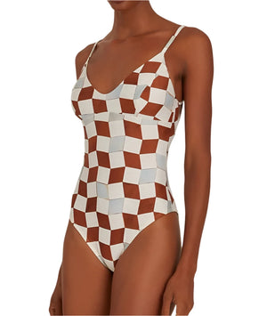 Person wearing the Lenny Niemeyer Back Strap One Piece swimsuit, showcasing a bold Casablanca print with geometric inspiration and thin straps.