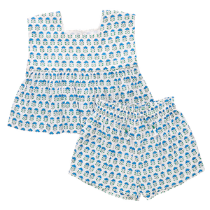 The Pink Chicken Girls' Kamari 2-Piece Set includes a sleeveless top and elastic waist shorts, showcasing a charming blue floral print on white, perfect for summer.