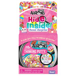 Crazy Aarons' Hide Inside Thinking Putty, Sweet Surprise edition, features colorful packaging with vibrant sweet illustrations and a fun challenge to find hidden pieces.