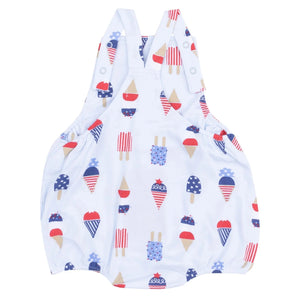 The Angel Dear Baby Boys' Bamboo American Ice Cream Pocket Sunsuit features overall straps and breathable bamboo fabric, decorated with red, white, and blue ice cream cone and popsicle prints.