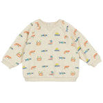 The Felicien Terry Sweatshirt by Arsene & Les Pipelettes is a cream-colored baby sweater made of soft terry cloth, featuring cheerful fish, crab, sailboat, and sun patterns. Ideal for a cozy day by the shore.