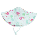 The Angel Dear Wide Brim Sunhat features a light blue organic muslin fabric with pink flamingo and green leaf prints, plus a chin strap for secure sun protection.