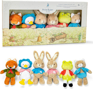 The Kids Preferred Beatrix Potter Classic Character 6 Piece Gift Set features plush toys of a fox, duck, two rabbits, frog, and cat—great for kids’ gifts—shown both inside the box and arranged in front of it.