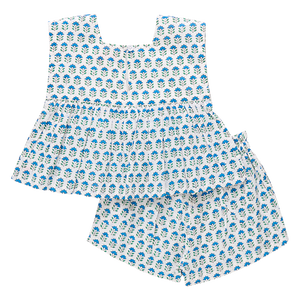 The Pink Chicken Girls' Kamari 2-Piece Set features a blue and white floral-patterned sleeveless top and matching pleated shorts with an elastic waist for comfort.