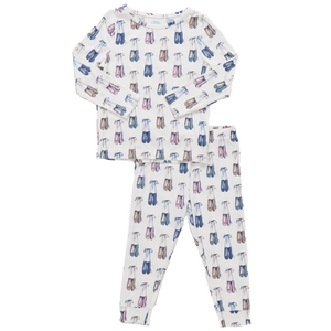 The Pink Chicken Kids' Bamboo PJ Set features a white long sleeve top and pants with colorful eyeglass prints in blue, pink, and brown. Crafted from soft bamboo for ultimate comfort.