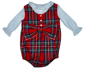 The Lolli Bow Back Bubble by Brown Bowen & Company showcases a festive Tybee Tartan design with white ruffled long sleeves and a large front bow, accented by white buttons, perfect for any occasion.