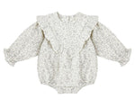 The Rylee & Cru Baby Girls' Winnie Romper showcases a charming floral print, ruffled shoulders, elastic cuffs, and a bubble silhouette with bottom snaps, displayed flat on a white background.