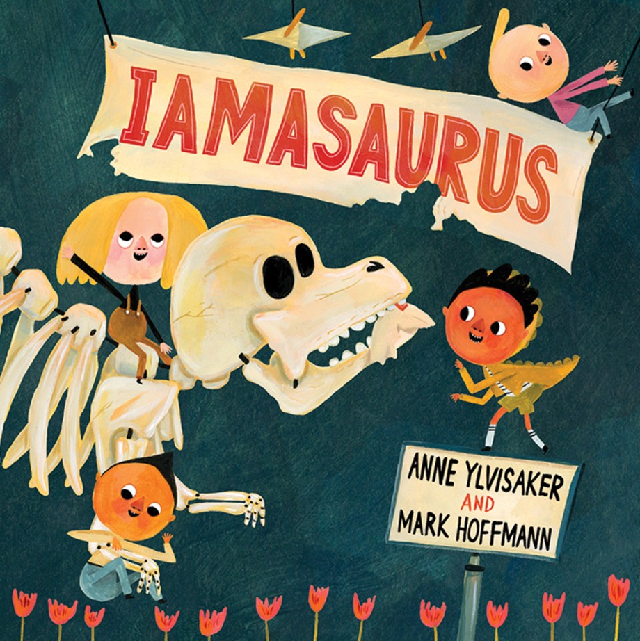 An illustration of children dressed as dinosaurs and pilots with a large skeleton labeled "I Am a Saurus" promotes the children's picture book "Iamasaurus" by Anne Ylvisaker and Mark Hoffmann, published by Abrams.