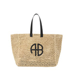 Large Rio Tote by Anine Bing, crafted from woven seagrass, features black handles and a striking black ANINE BING monogram on the front.